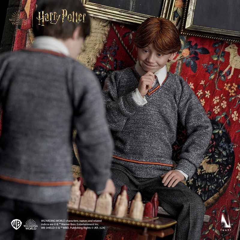 Sculpture of Ron Weasley with Gryffindor robe and characteristic ginger hair