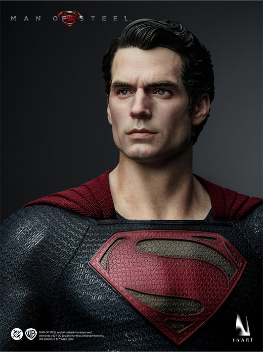 Close-up of the INART Superman collectible figure featuring the calm head sculpt and House of El emblem