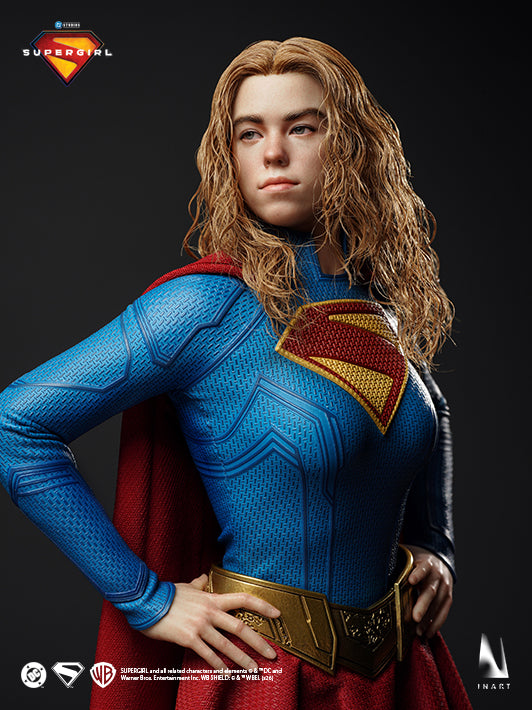 INART Supergirl collectible figure hands-on-hips pose with red cape and gold belt