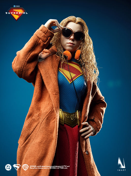 Supergirl 2026 collectible figure in trench coat adjusting her sunglasses