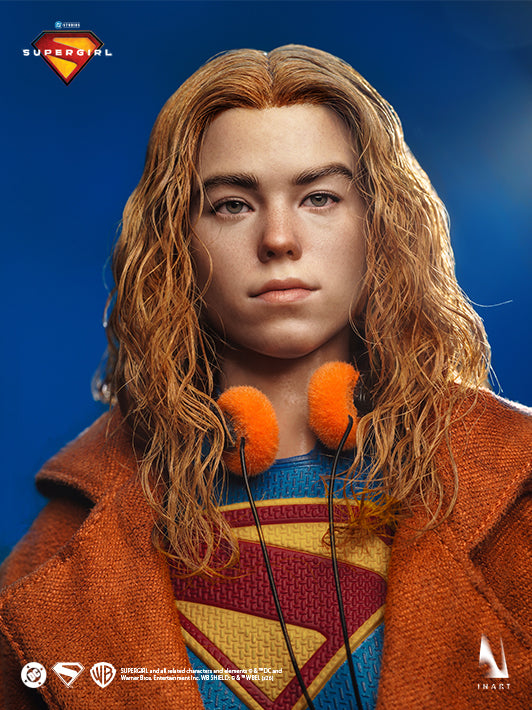 Supergirl 2026 collectible figure portrait with trench coat and orange headphones