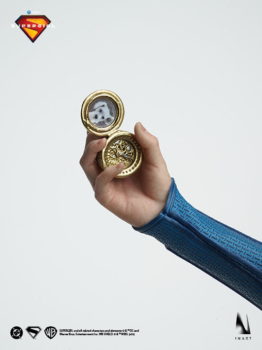 Supergirl 2026 figure holding an open pocket watch accessory close-up
