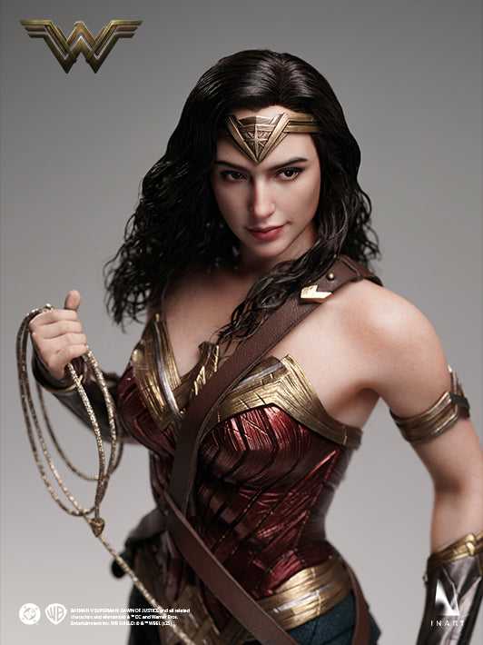 Wonder Woman action figure holding Lasso of Truth in dynamic pose, featuring detailed Amazonian armor