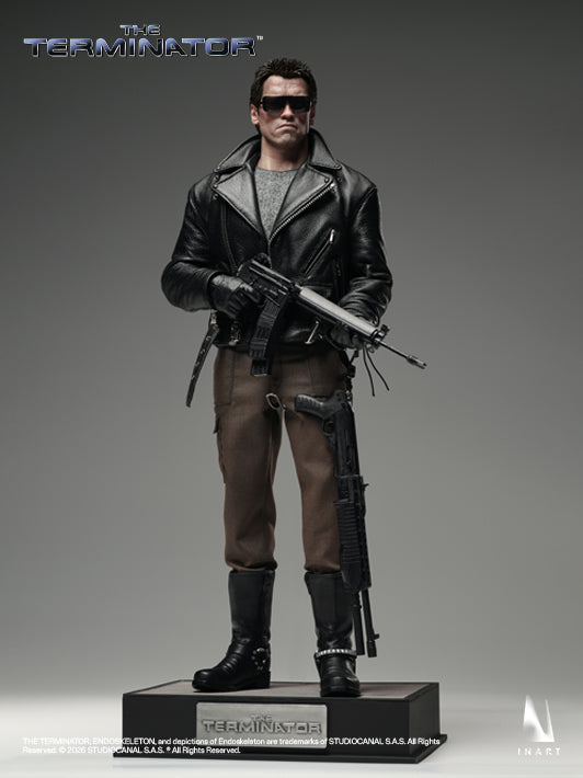 inart t800 sixth scale figure with battle-damaged details, holding a gun ready to fire