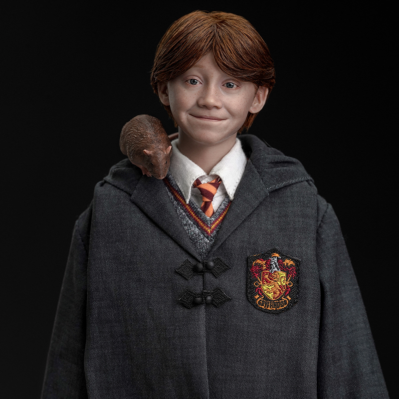 Detailed likeness of Ron Weasley in 1-6 scale by INART with iconic accessories.