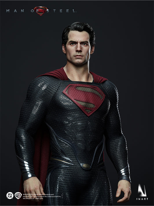 Front view of the INART Superman collectible figure posed with fists beside the textured Kryptonian suit
