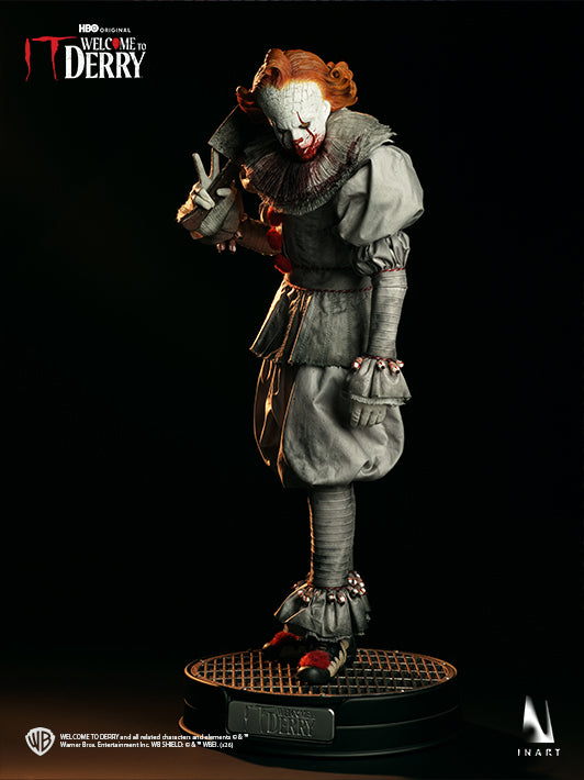 INART Pennywise 1/6 figure holding a machete on sewer pipe display base
